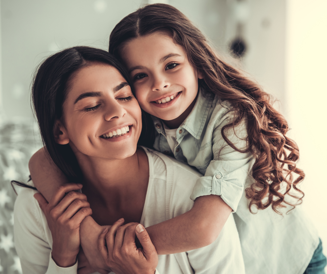 Image of a mom with her child on her back hugging her, which introduces the Expat Mom's Stories section for the Firenze Moms 4 Moms Network